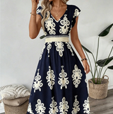 Candela - Vestido maxi barroco con escote en V