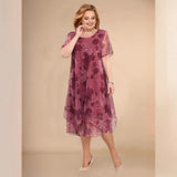 Elegante vestido asimétrico de gasa floral de manga corta