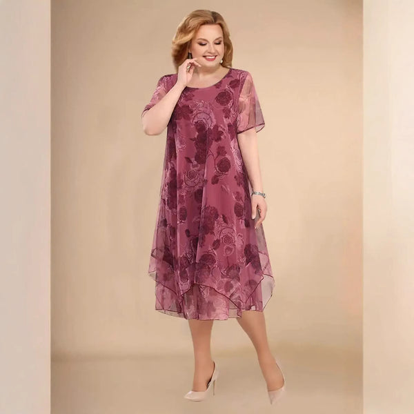 Elegante vestido asimétrico de gasa floral de manga corta